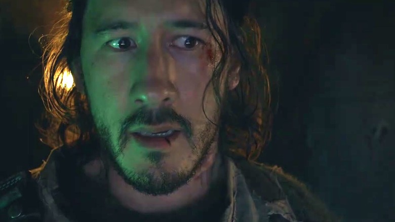 Mark Fischbach as the lead character with a look of concern on his face in Iron Lung