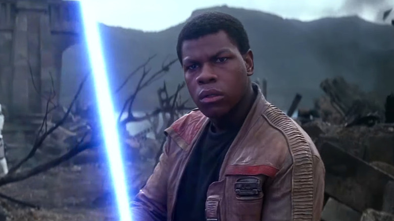 Finn (John Boyega) wields Anakin Skywalker's original Lightsaber on Takodana in "Star Wars: The Force Awakens"