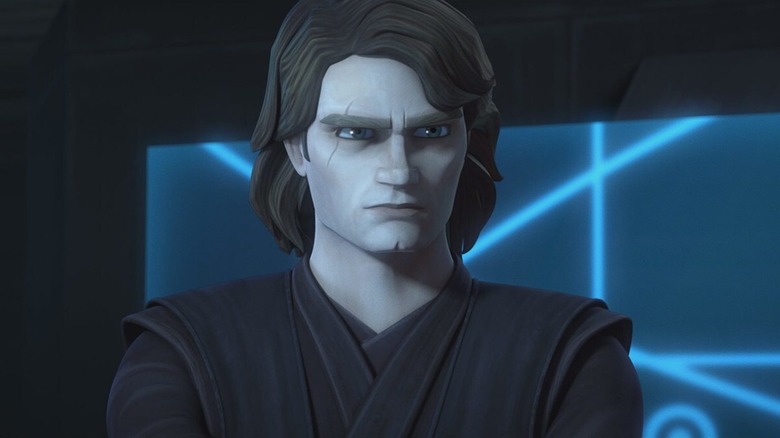 Anakin Skywalker withh his arms crossed in front of a display screen in Star Wars: The Clone Wars