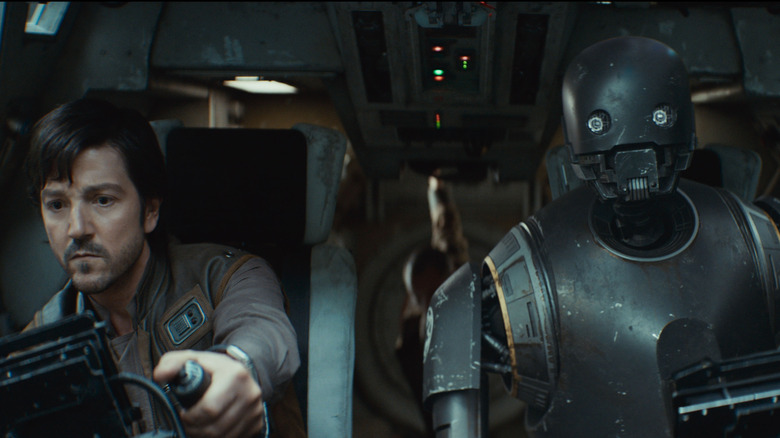 Diego Luna as Cassian Andor and Alan Tudyk as K-2SO at the controls of a spacecraft in Andor