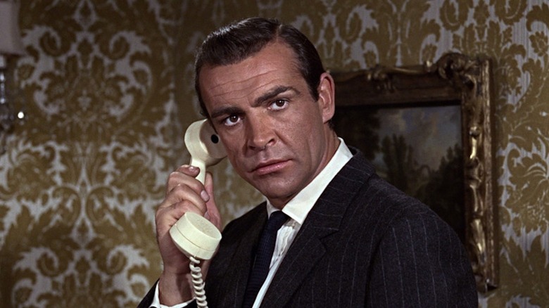 Sean Connery takes an important phone call as James Bond in From Russia with Love