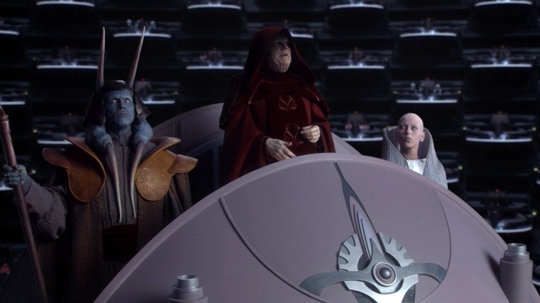 Palpatine declares himself Emperor, with Mas Amedda and Sly Moore at his side