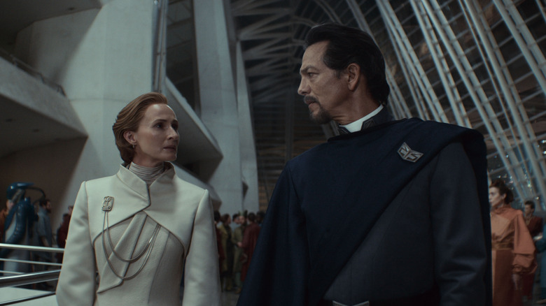 Geneviève O'Reilly as my Mothma and Benjamin Bratt as an Organa lease sharing a worried look in Andor