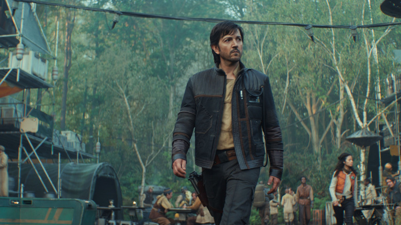 Diego Luna as Cassian Andor walking on Yavin 4 in Andor
