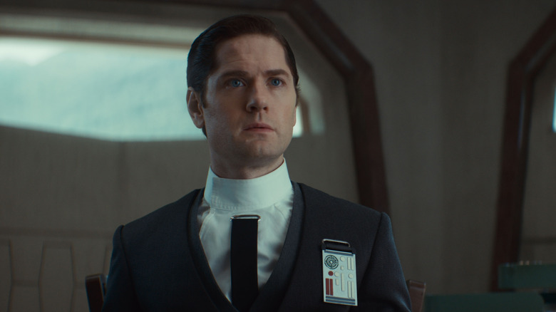 Syril Karn with a look of bewilderment on his weasel face in Andor