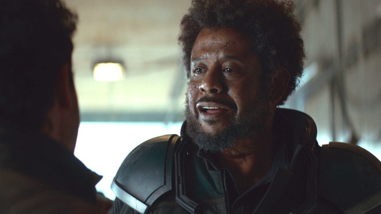 Saw Gerrera talks to someone off frame as he looks sad in Andor