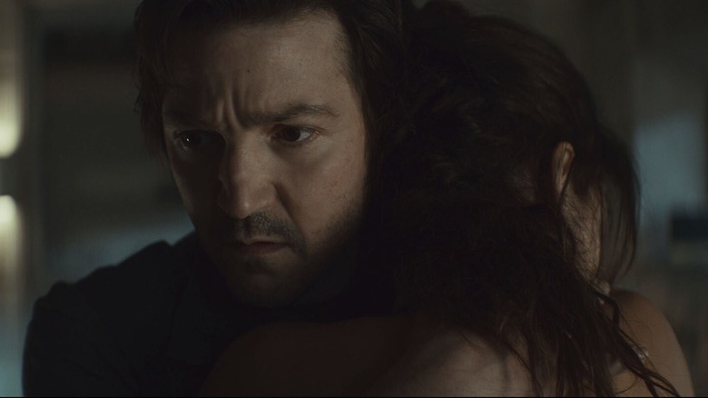 Cassian and Bix holding each other in Andor season 2