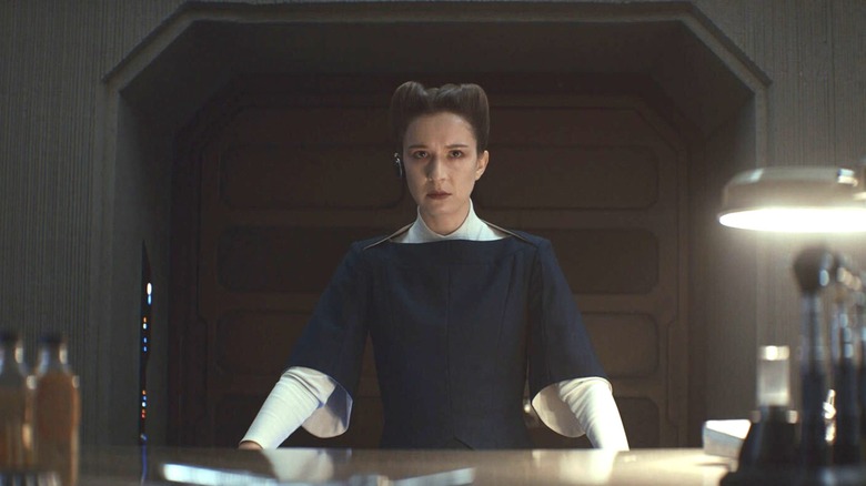 Kleya looking nervous alone in Luthen's shop on Coruscant in Andor season 2