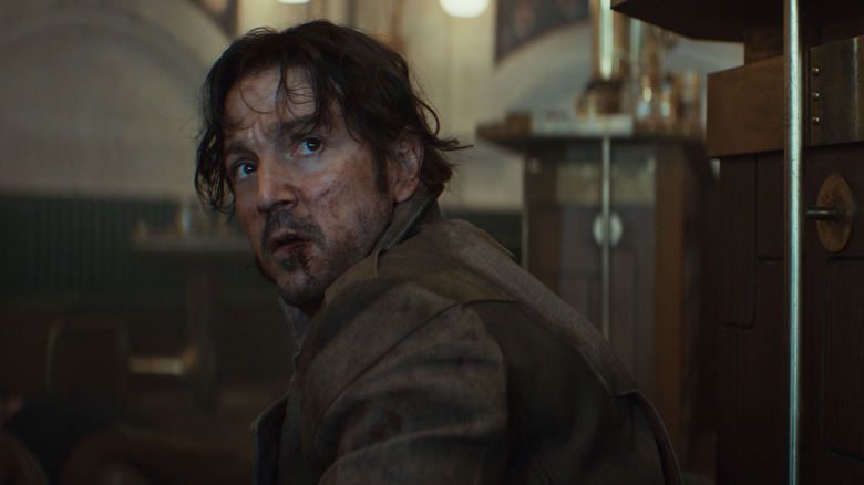 Diego Luna as Cassian Andor looking bruised and battered after a fight in Andor