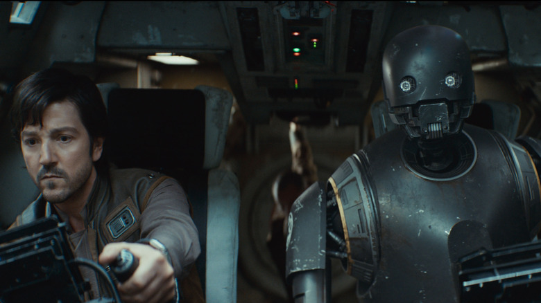 Diego Luna as Cassian Andor and Alan Tudyk as K-2SO at the controls of a starship in Andor