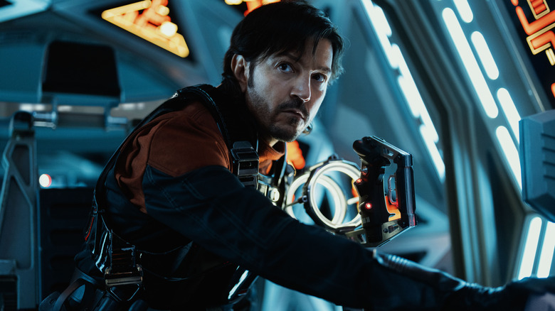 Diego Luna as Cassian Andor at the controls of a starship in Andor season 2