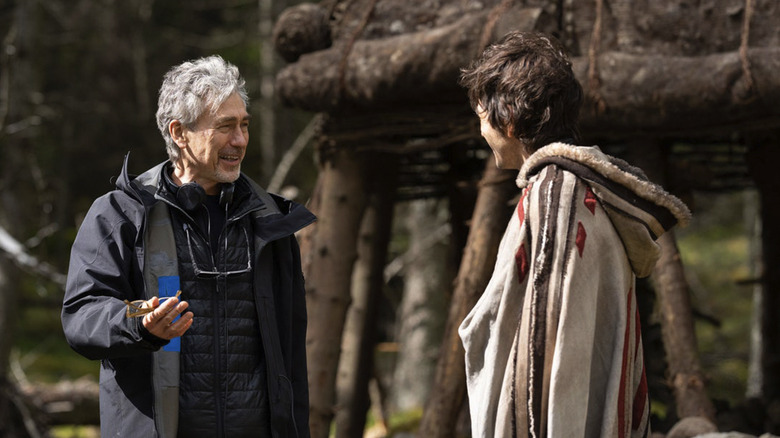 Tony Gilroy smiles at Diego Luna behind the scenes on the set of Andor season 2