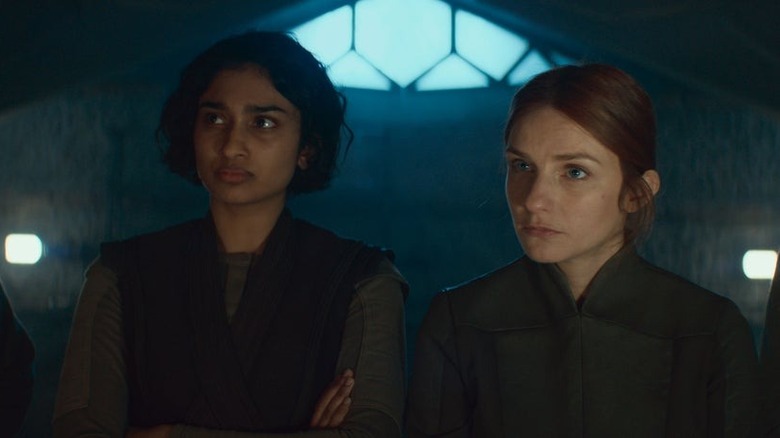Vel and Cinta at a resistance planning meeting in Andor season 2