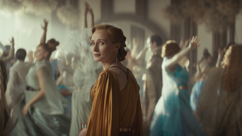 Mon Mothma looking back with fear in her eyes in the middle of a wedding party in Andor