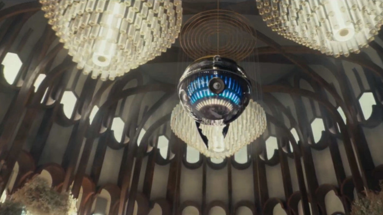 A disco droid floats around a wedding reception blasting bangers in Andor