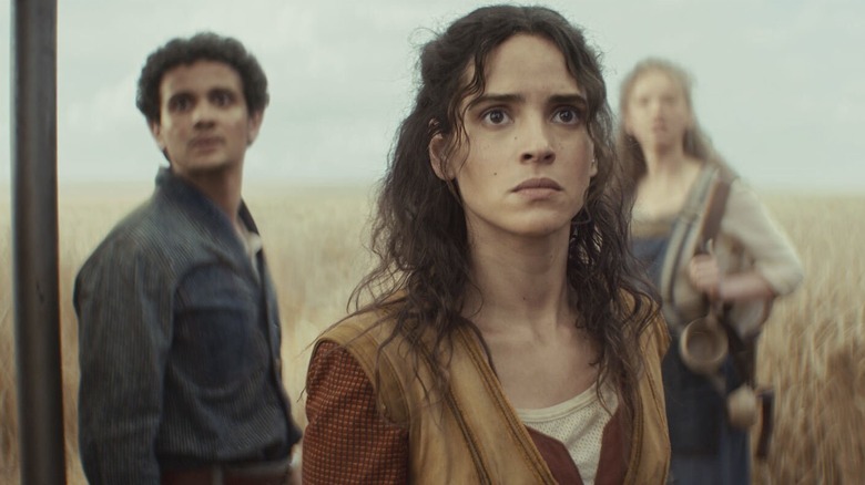 Bix and Wilmon standing in a field on Mina-Rau in Andor season 2
