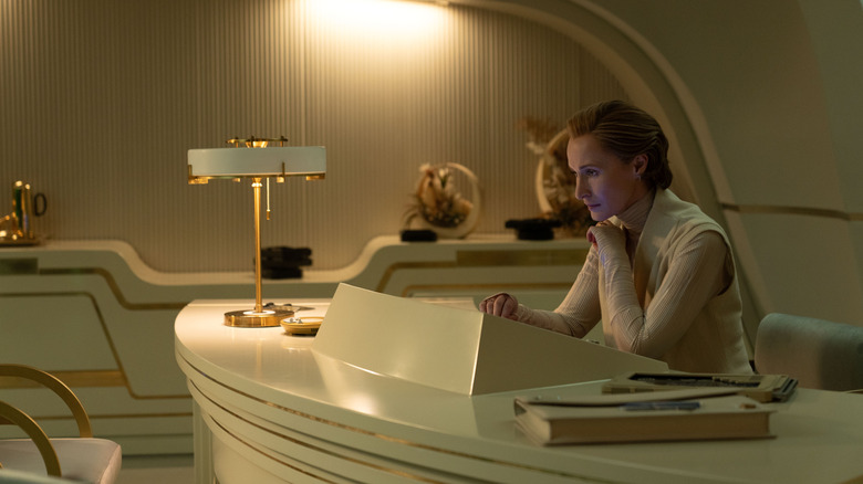 Genevieve O'Reilly as Mon Mothma sitting at her deck in heavy concentration in Andor season 2