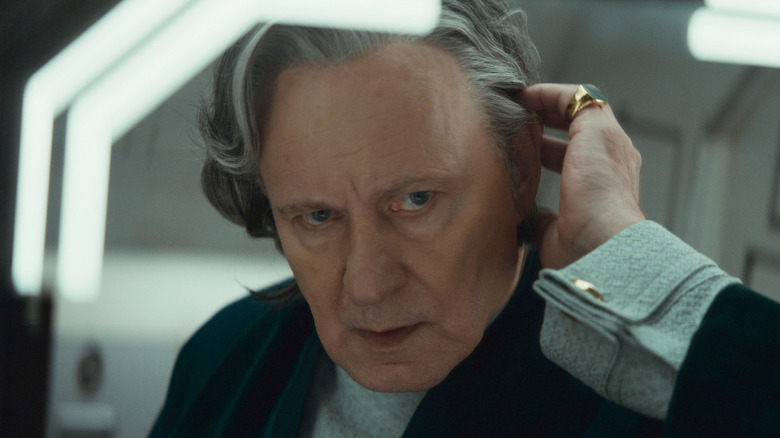 Luthen Rael checking his wig in a mirror in Andor season 2