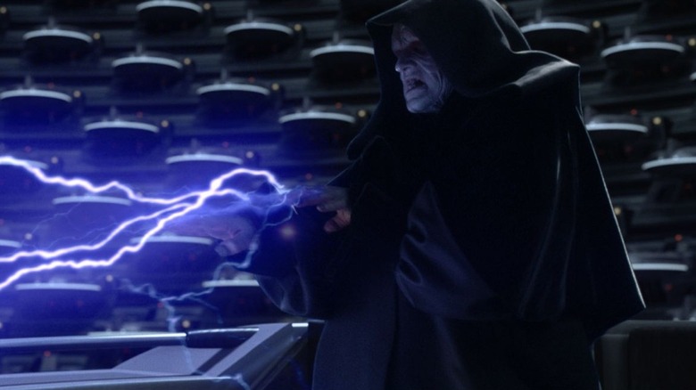 Ian McDiarmid as Emperor Palpatine shooting lightning from his fingertips in Star Wars: Revenge of the Sith