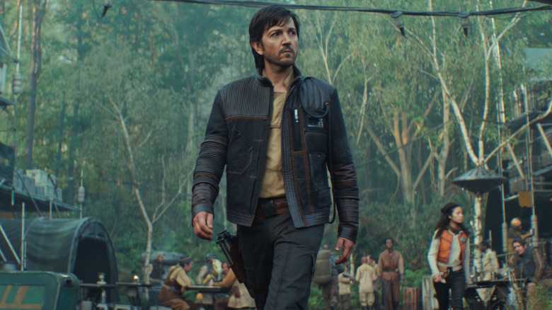 Diego Luna as Cassian Andor walking through the Yavin Rebel base at the end of Andor season 2