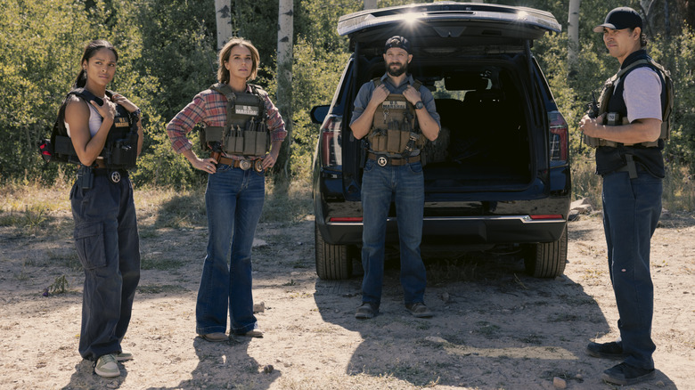 Ash Santos' Andrea Cruz, Arielle Kebbel's Belle Skinner, Logan Marshall-Green's Pete Calvin, and Tatanka Means' Miles Kittle stand by their truck in Marshals.jpg