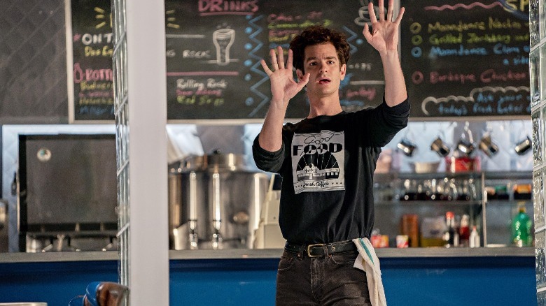 Jonathan Larson cafe hands up