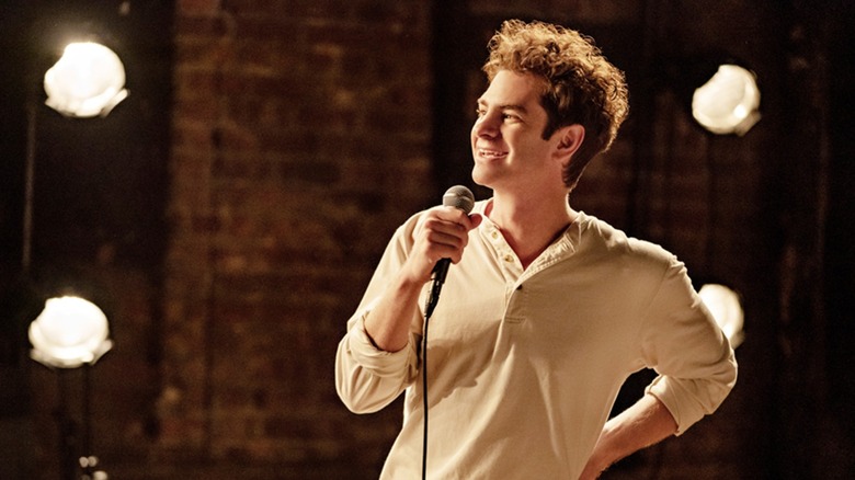 Smiling Jonathan Larson with microphone