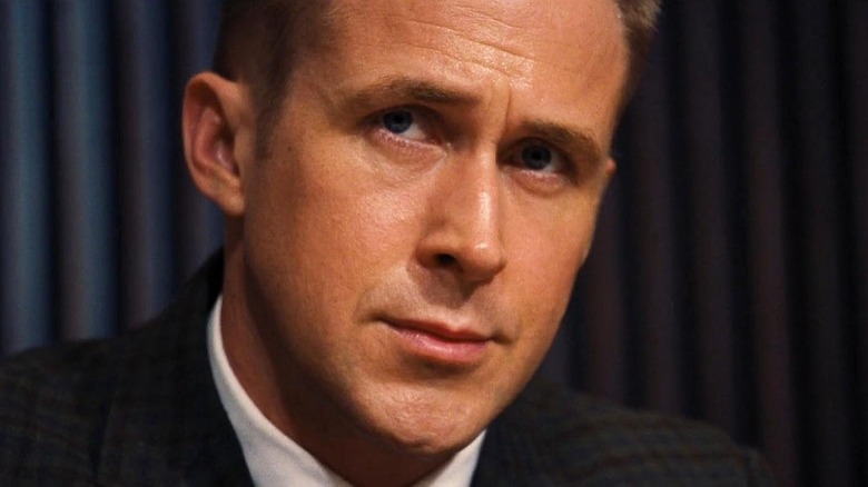 Ryan Gosling as Neil Armstrong looking thoughtful while wearing a suit in First Man
