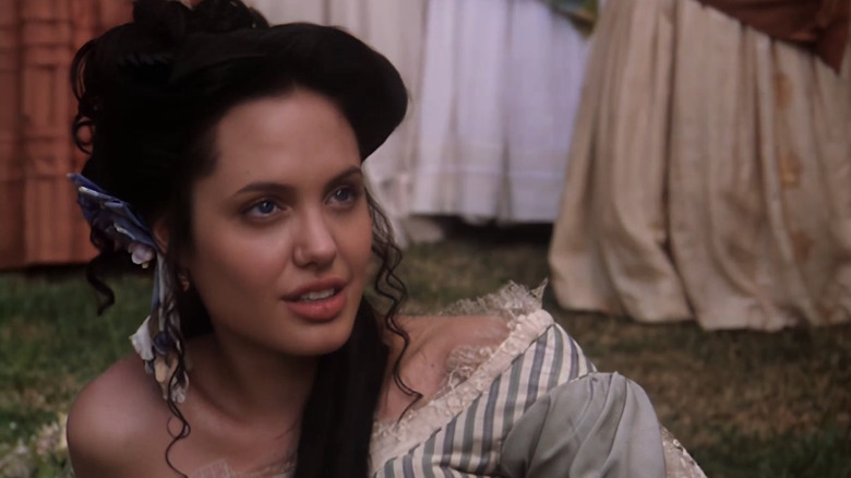 Angelina Jolie's Georgia Lawshe Woods is seen in closeup as she looks up while laying on the ground in True Women