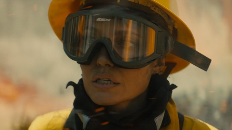 Angelia Jolie as Hannah Faber looking worried while wearing goggles and fire protection gear in Those Who Wish Me Dead