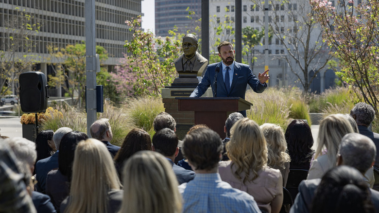 Ben Affleck's Mark Kimball gives a speech in downtown Los Angeles in Animals