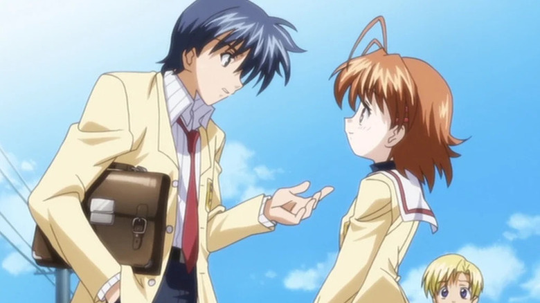 Tomoya Okazaki speaks to Nagisa Furukawa in the front of a blue sky in Clannad