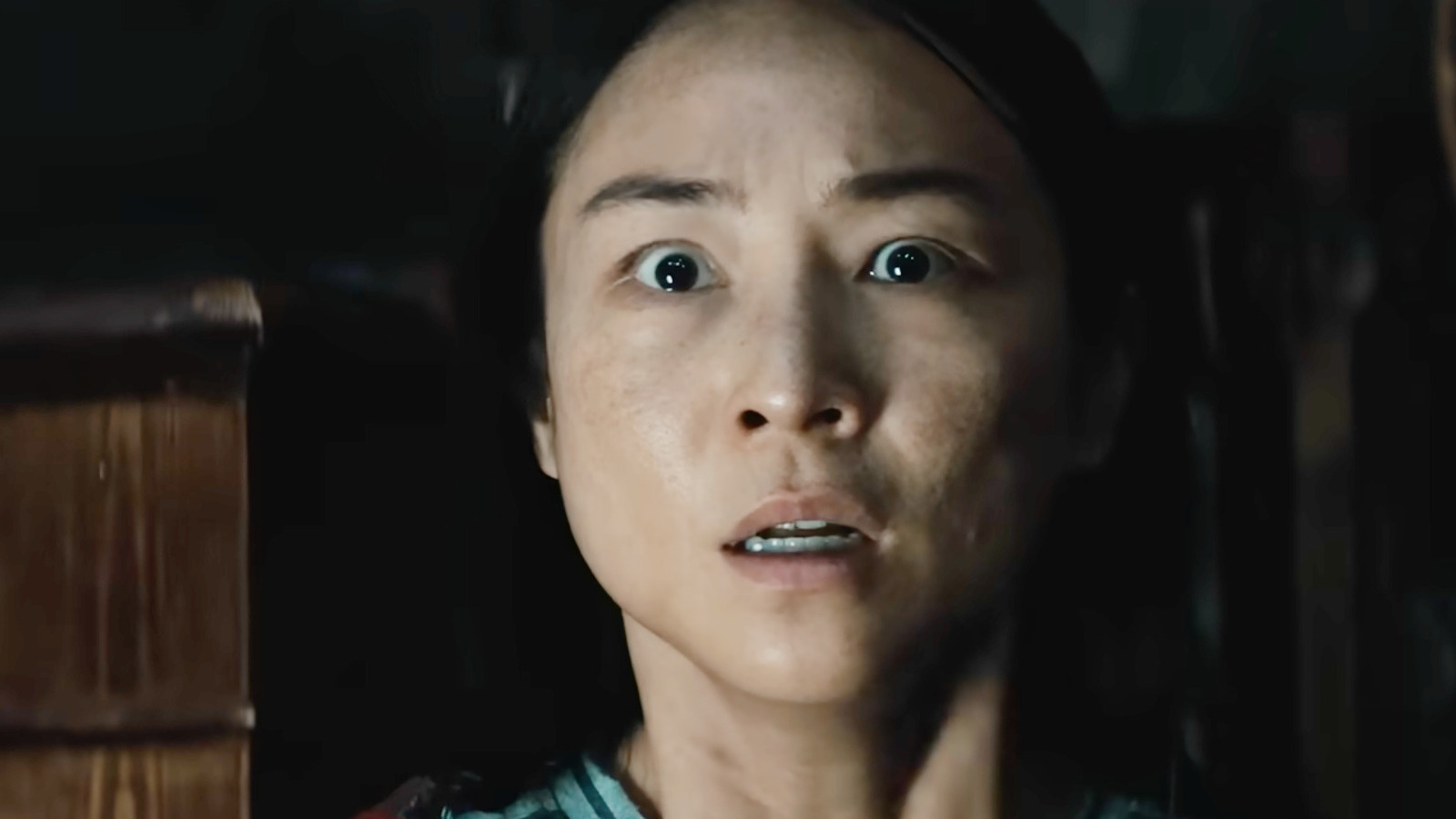 Greta Lee as Ann trapped during the storm in The Last House