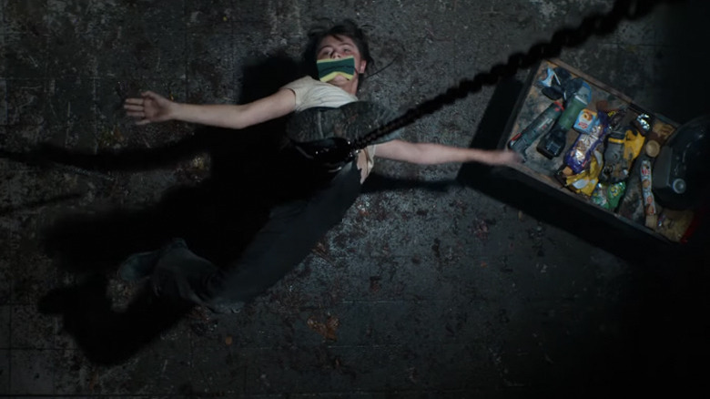 Anna hanging from a chain