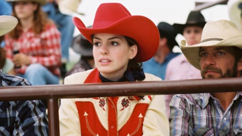 Lureen in a red hat at a rodeo in Brokeback Mountain
