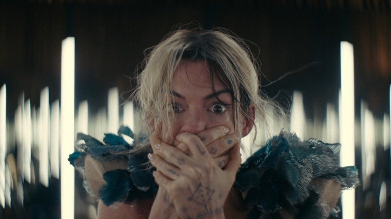 Anne Hathaway as Mother Mary covers her mouth in horror in Mother Mary