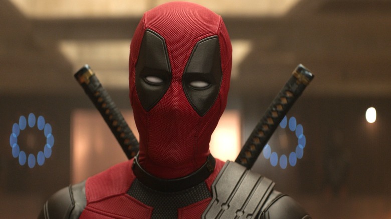 Ryan Reynolds as Deadpool standing in the TVA in his new suit in Deadpool & Wolverine