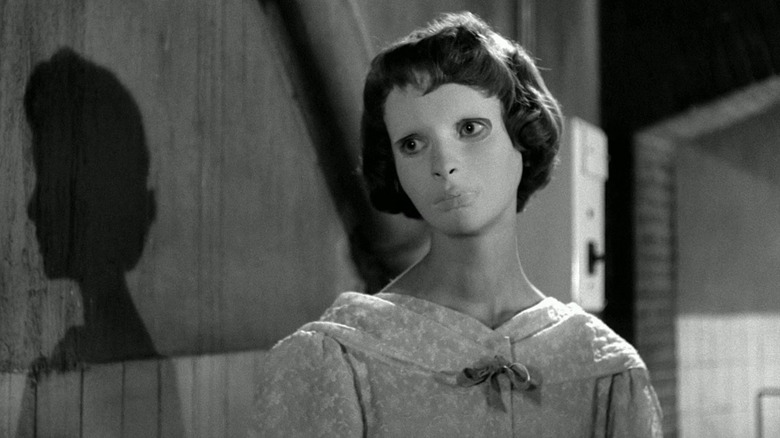 Christiane Génessier (Édith Scob) wears a mask and stalks in Eyes Without a Face