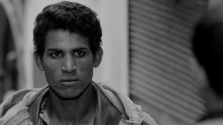 Ali La Pointe (Brahim Hadjadj) glowers in The Battle of Algiers