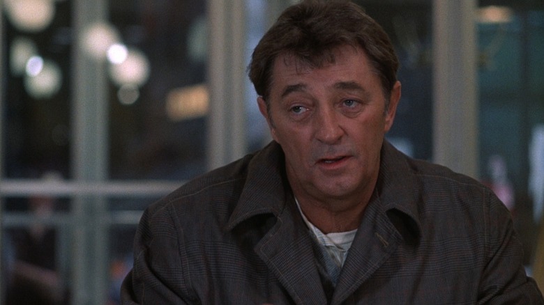 Eddie Coyle (Robert Mitchum) speaks and mopes in The Friends of Eddie Coyle
