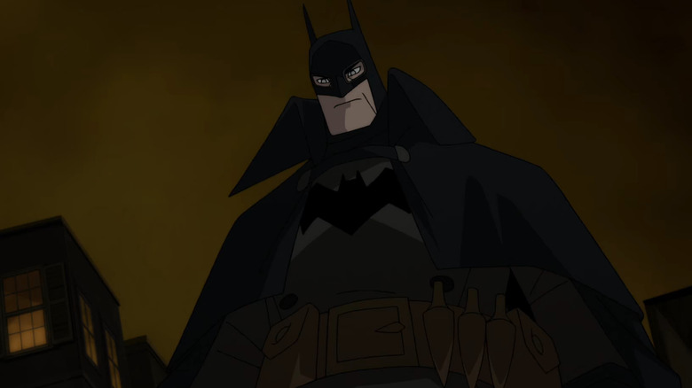 Batman looking down on the streets of Gotham in Batman: Gotham By Gaslight