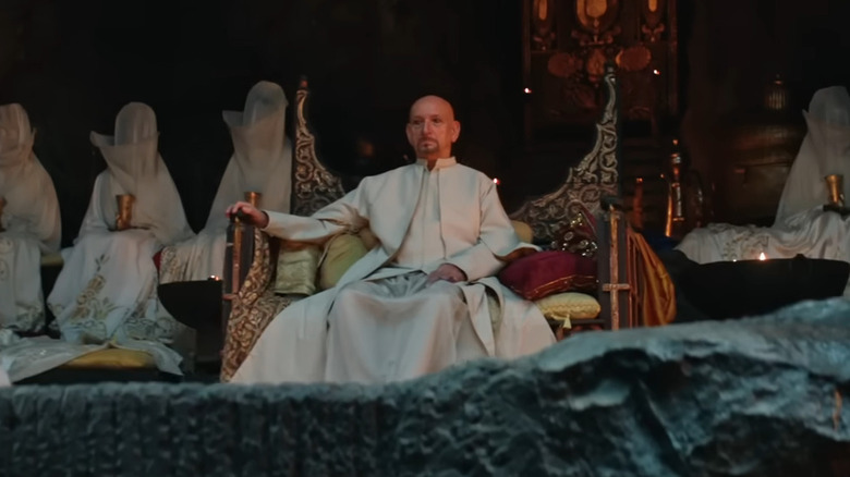 Ben Kingsley as Emperor Kisra II sitting on his throne in Desert Warrior