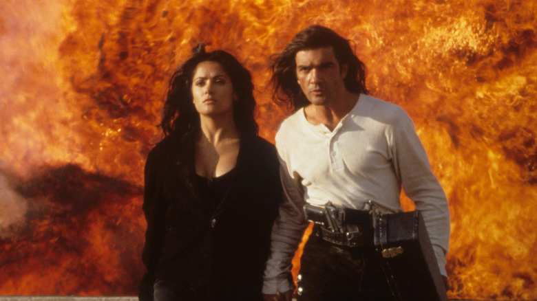 Carolina and El Mariachi walking away from an explosion in Deseprado