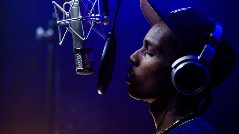 ASAP Rocky as Archie singing into a microphone in Highest 2 Lowest