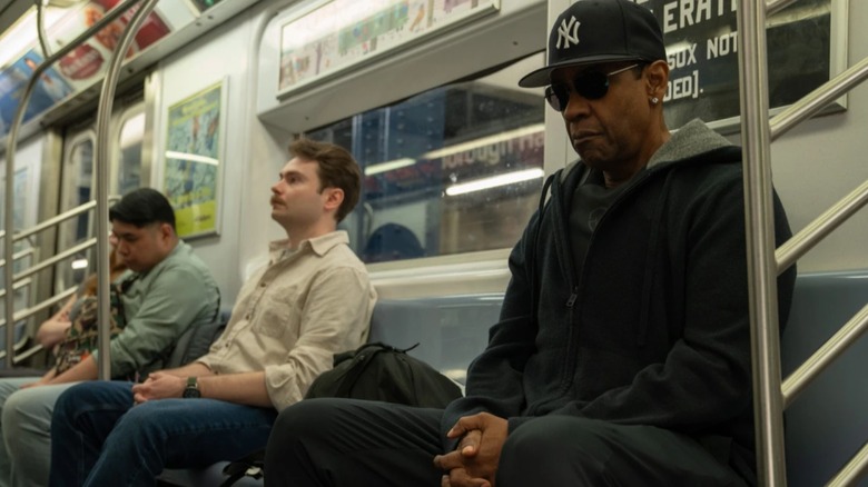 David King in dsiguise on a subway in Highest 2 Lowest