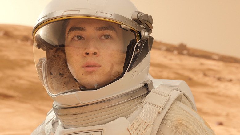 Alex Baldwin wearing a space suit on the surface of Mars in For All Mankind
