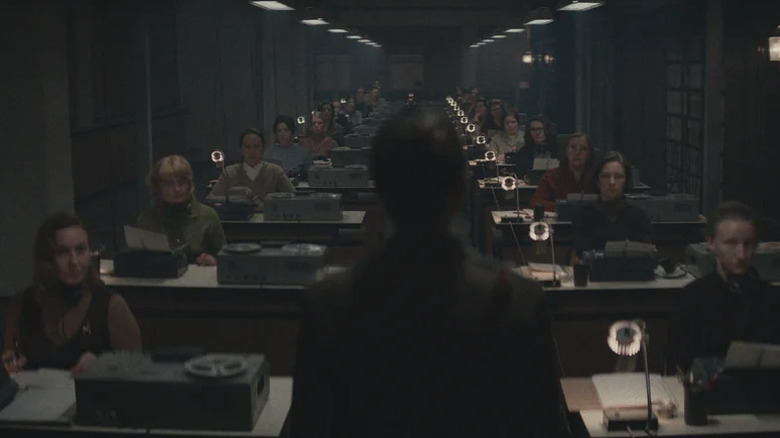 A KGB surveillance room full of people spying on others in Star City