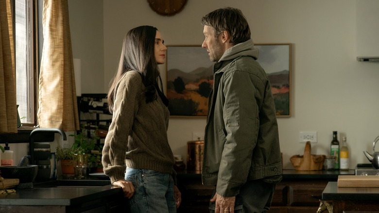 Jennifer Connelly as Daniela Dessen leaning against a kitchen counter opposite Joel Edgerton as Jason Dessen in Dark Matter