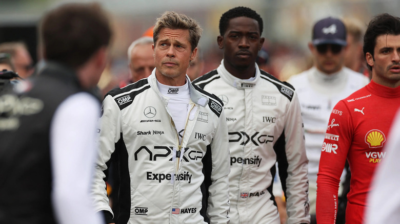 Sonny and Joshua walk alongside the racetrack in F1