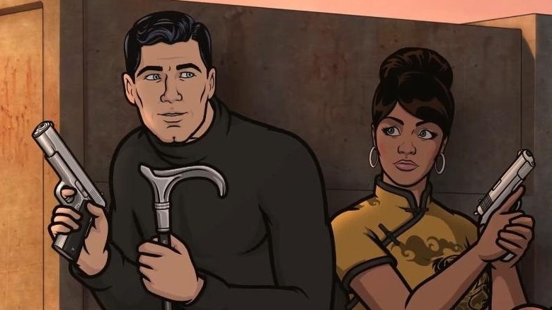 Archer and Lana crouching